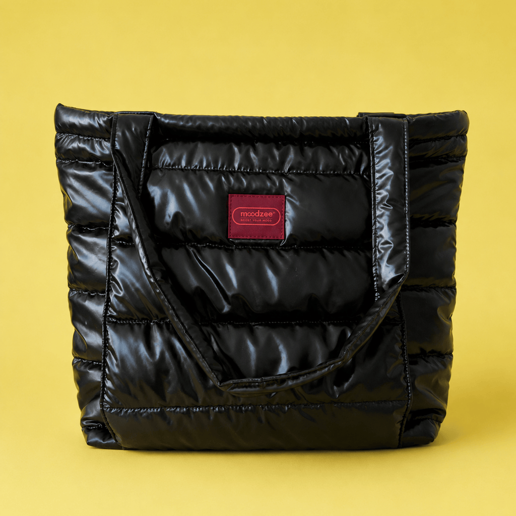 Moodzee Black Tote BagMoodzee quilted black bag close-up showing logo tag and quilted texture