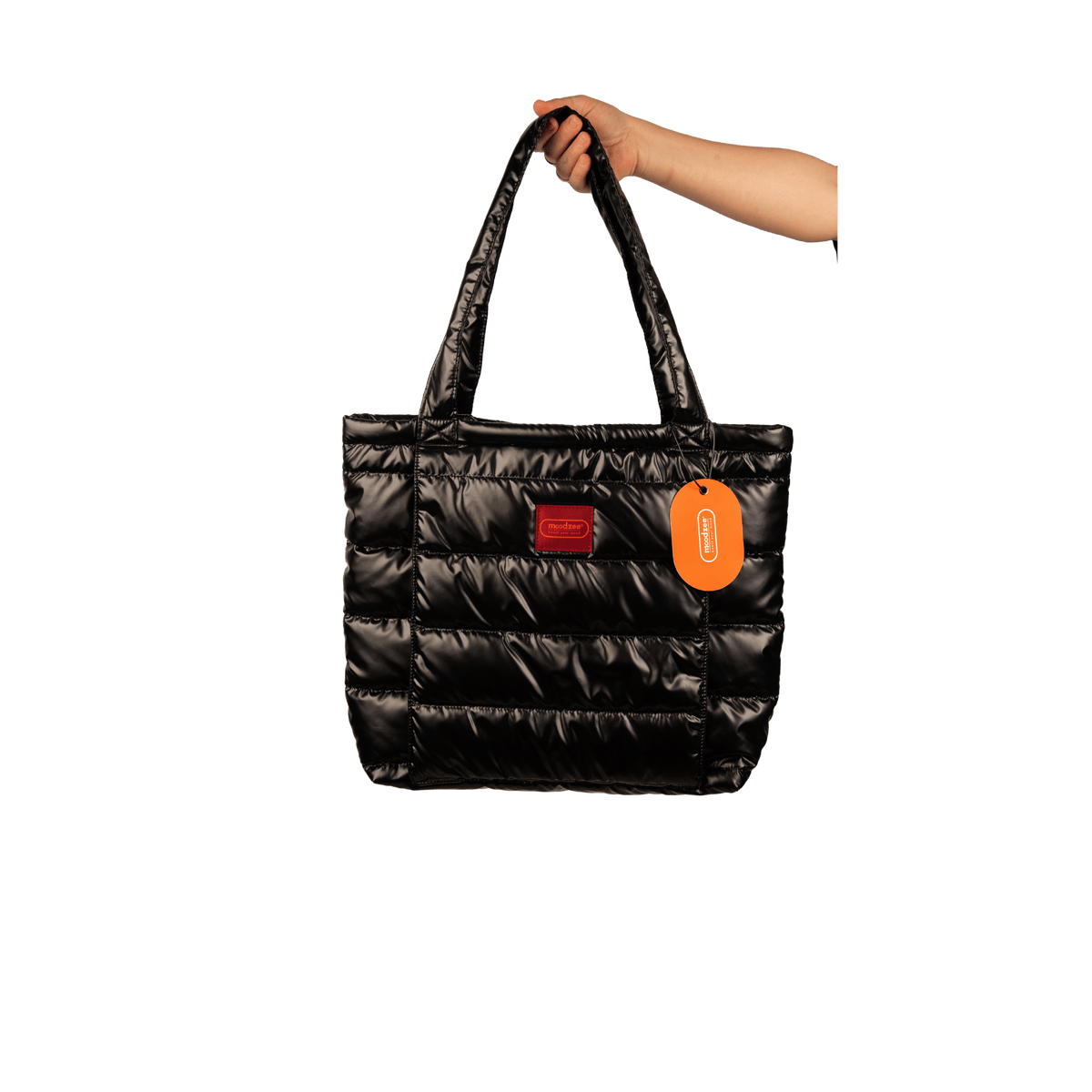 Moodzee quilted black bag with yoga mat pouch, held by shoulder strap