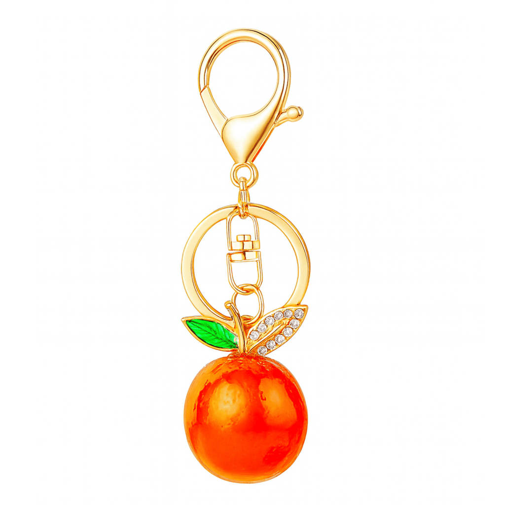 Gold keychain with an orange charm