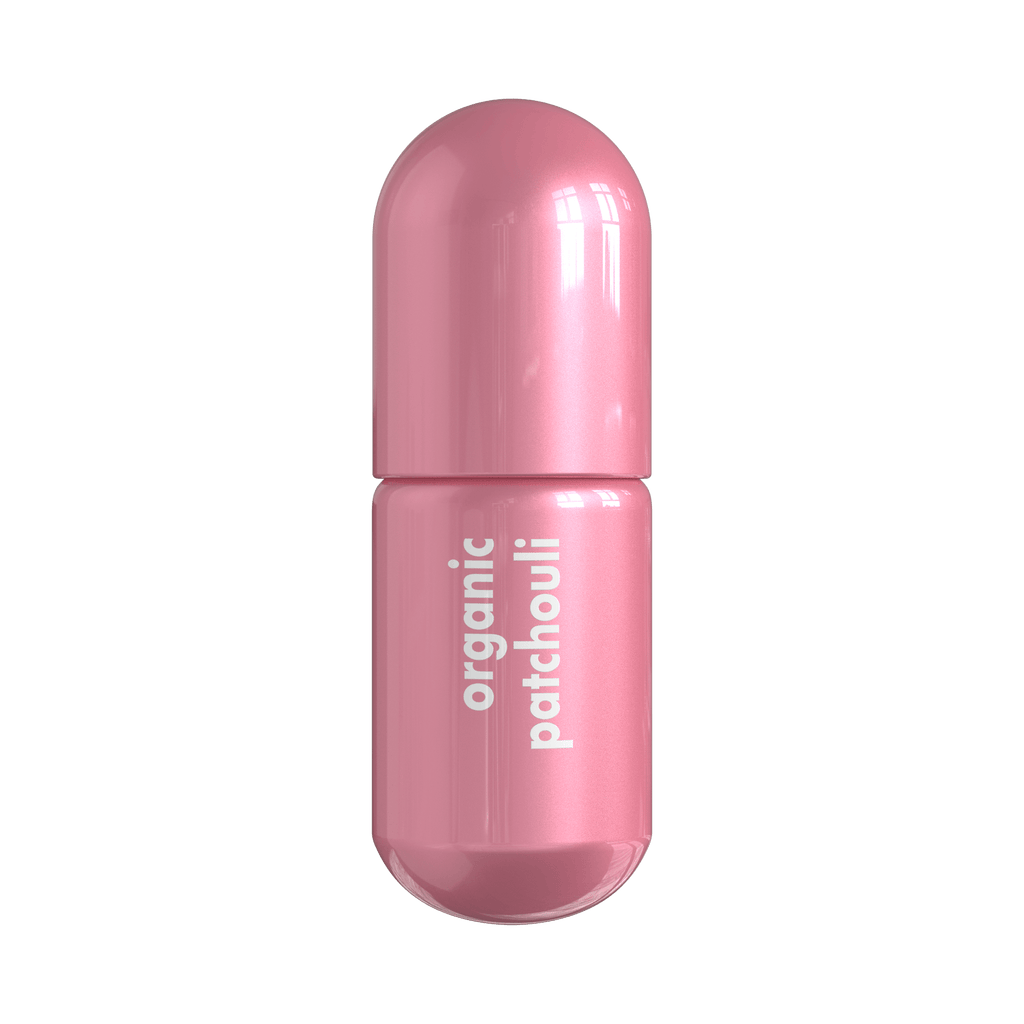 Patchouli Moodzee organic essential oil roller ball for earthy calm, pink pill bottle